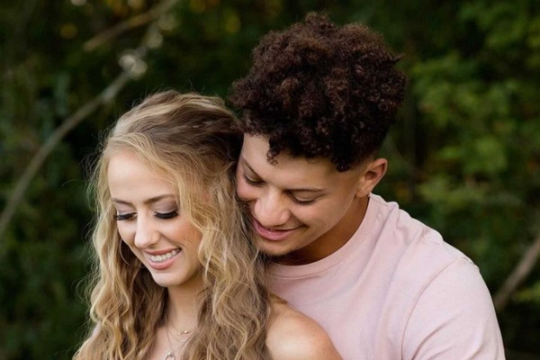 Patrick Mahomes and his pregnant wife Brittany share a rare family portrait with daughter Sterling, one